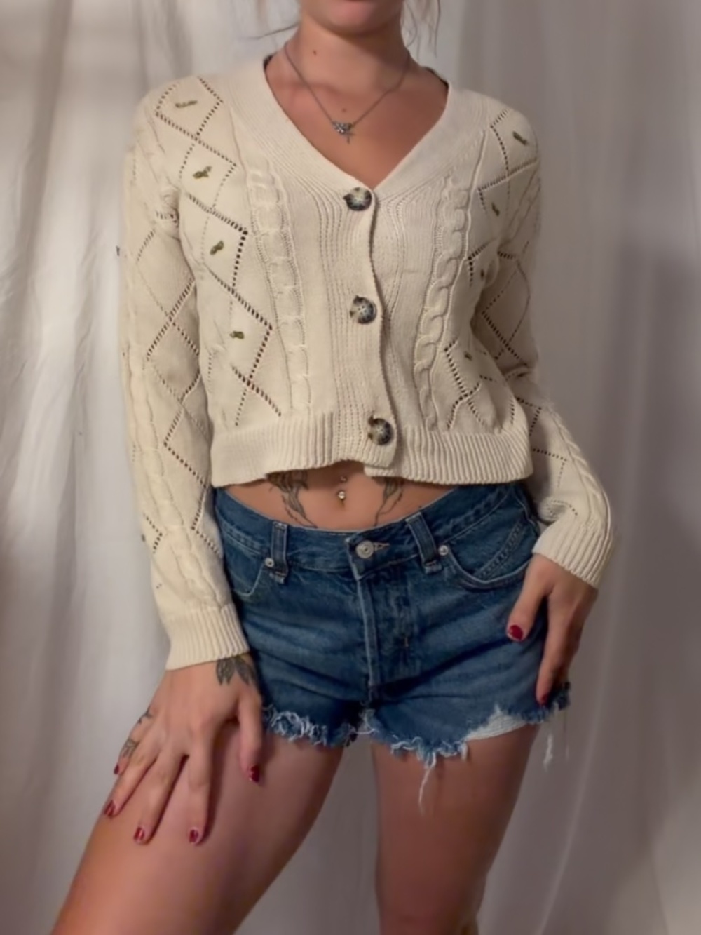 Cream knit button front cardigan with bows